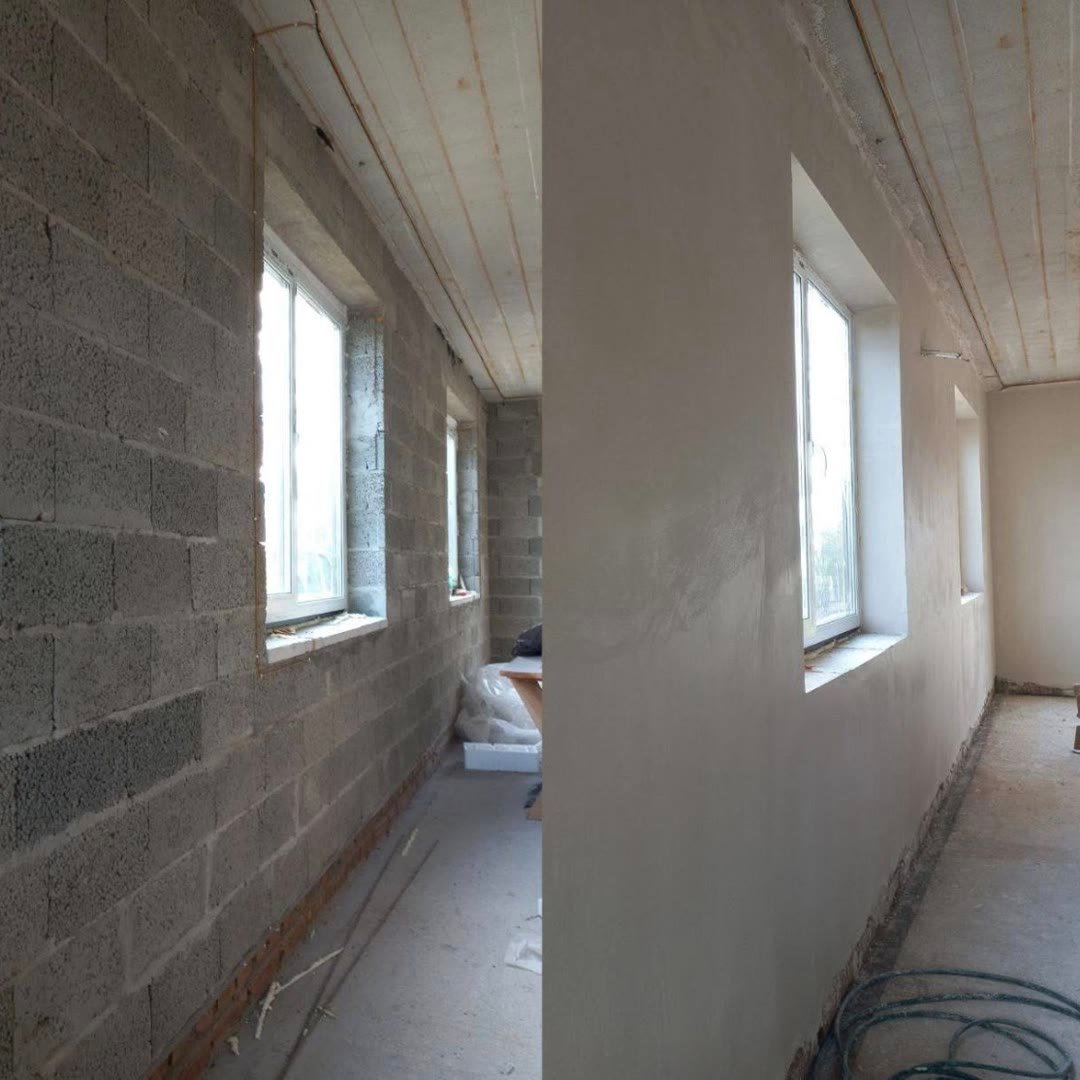 Split photograph of a long room: bare block wall with windows on the left, the same wall plastered on the right